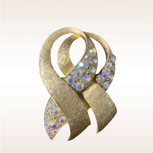 Antique, gold tone brooch with rhinestones